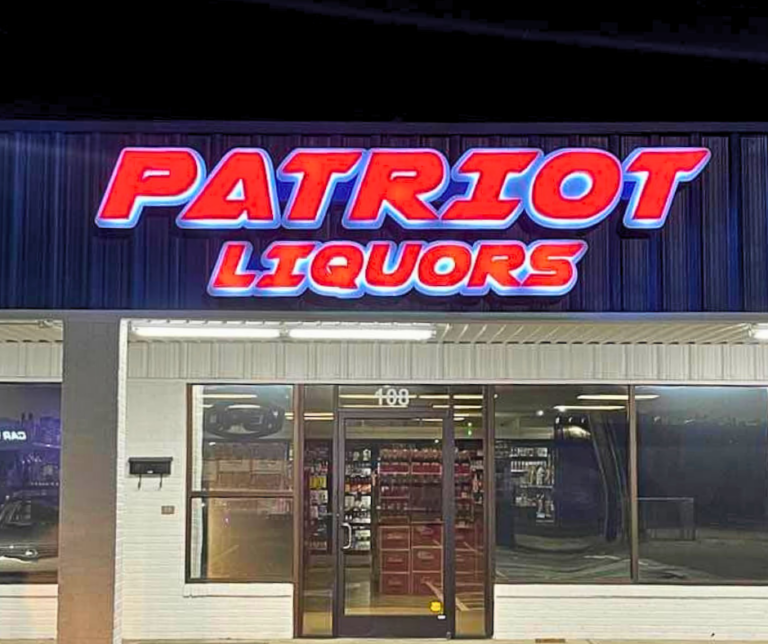 Patriot Liquors sign at Night